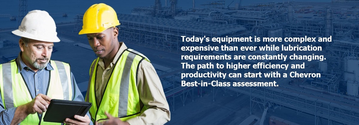 2 men checking hand held computer